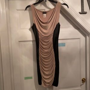 Tan and black tight dress.